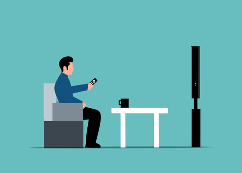 A man watching TV
