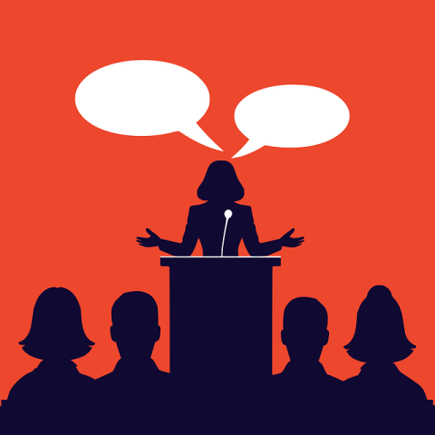 A person speaking from a podium